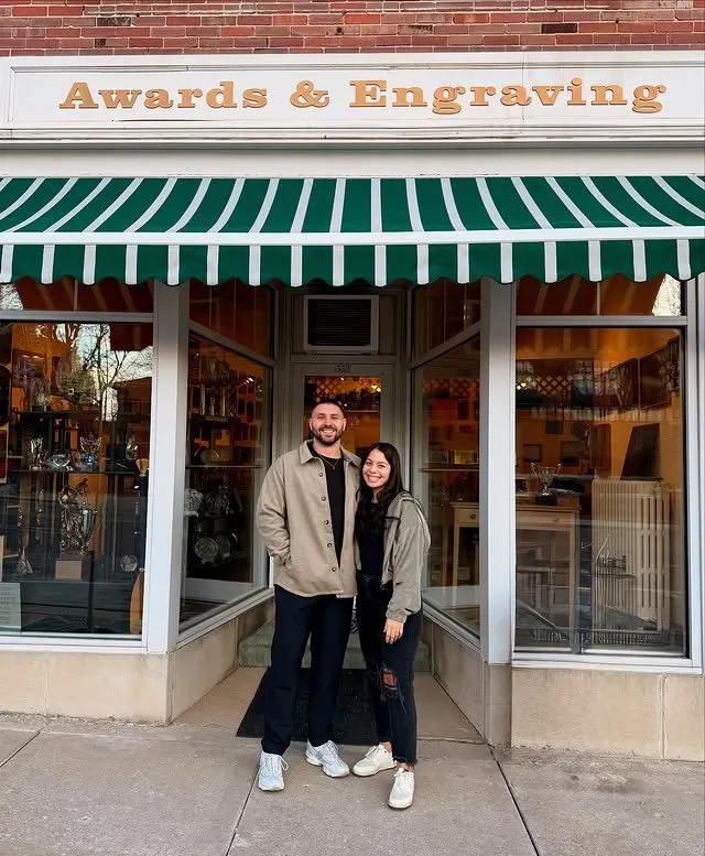 Owners Daniel and Bailey Mattson at the Awards & Engraving storefront